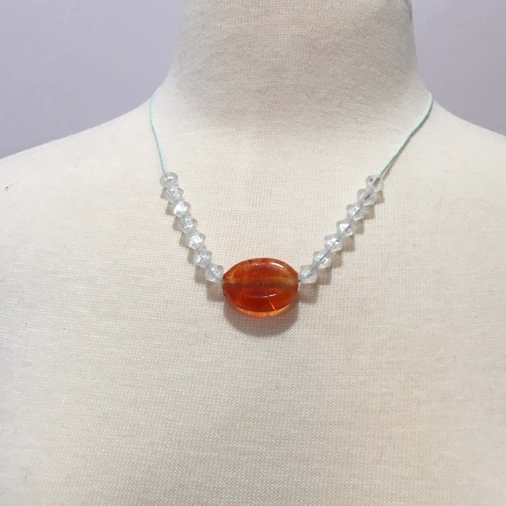 Clear beaded necklace with real stone pendant.